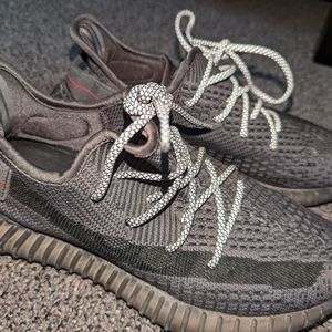 Black reflective Yeezys